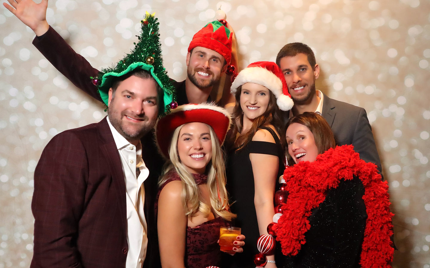 Holiday party guests in festive props