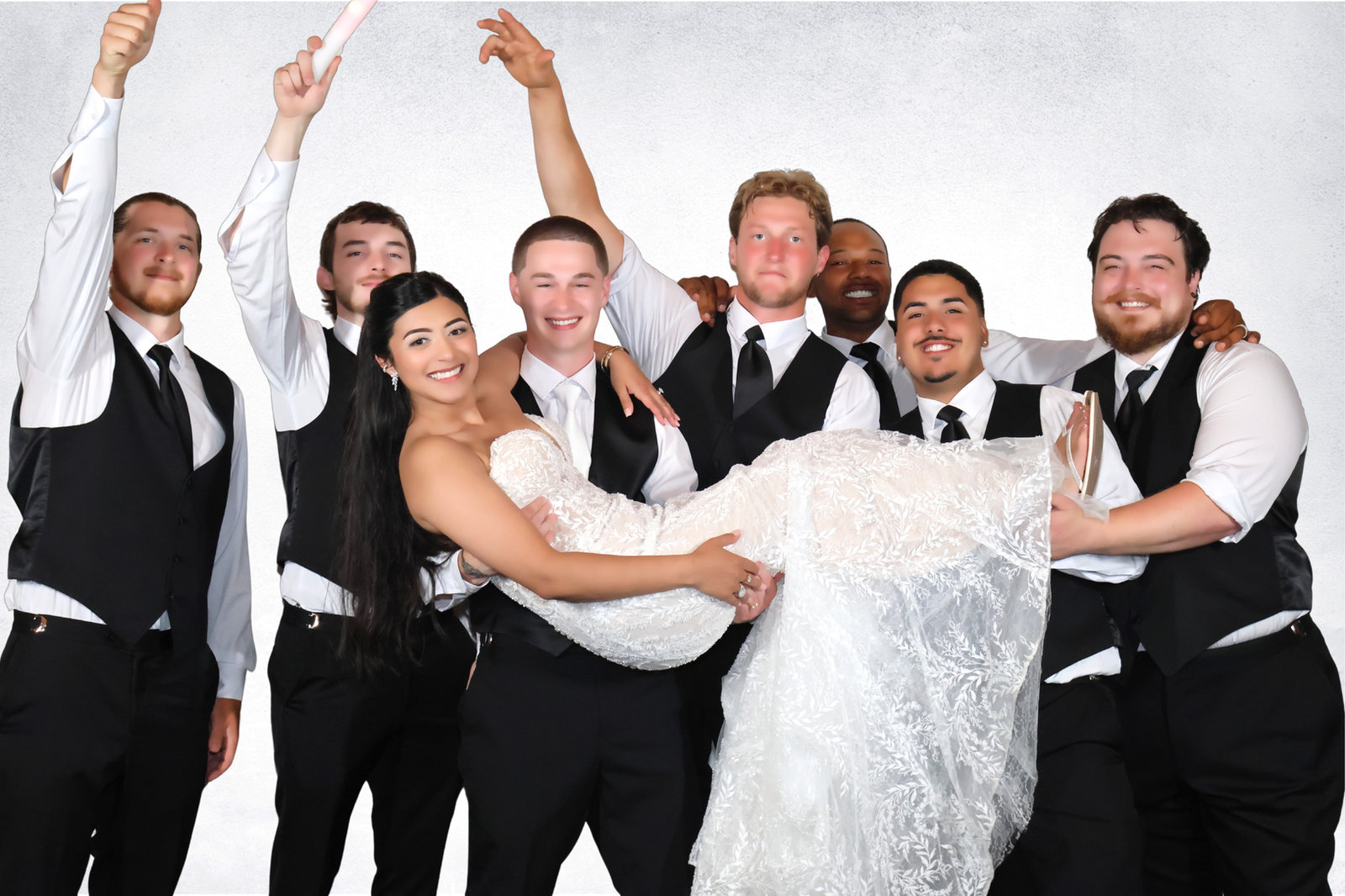 Groomsmen lifting the bride at the photo booth