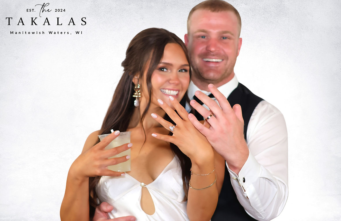Newlyweds showing off their rings in a full color Gala portrait