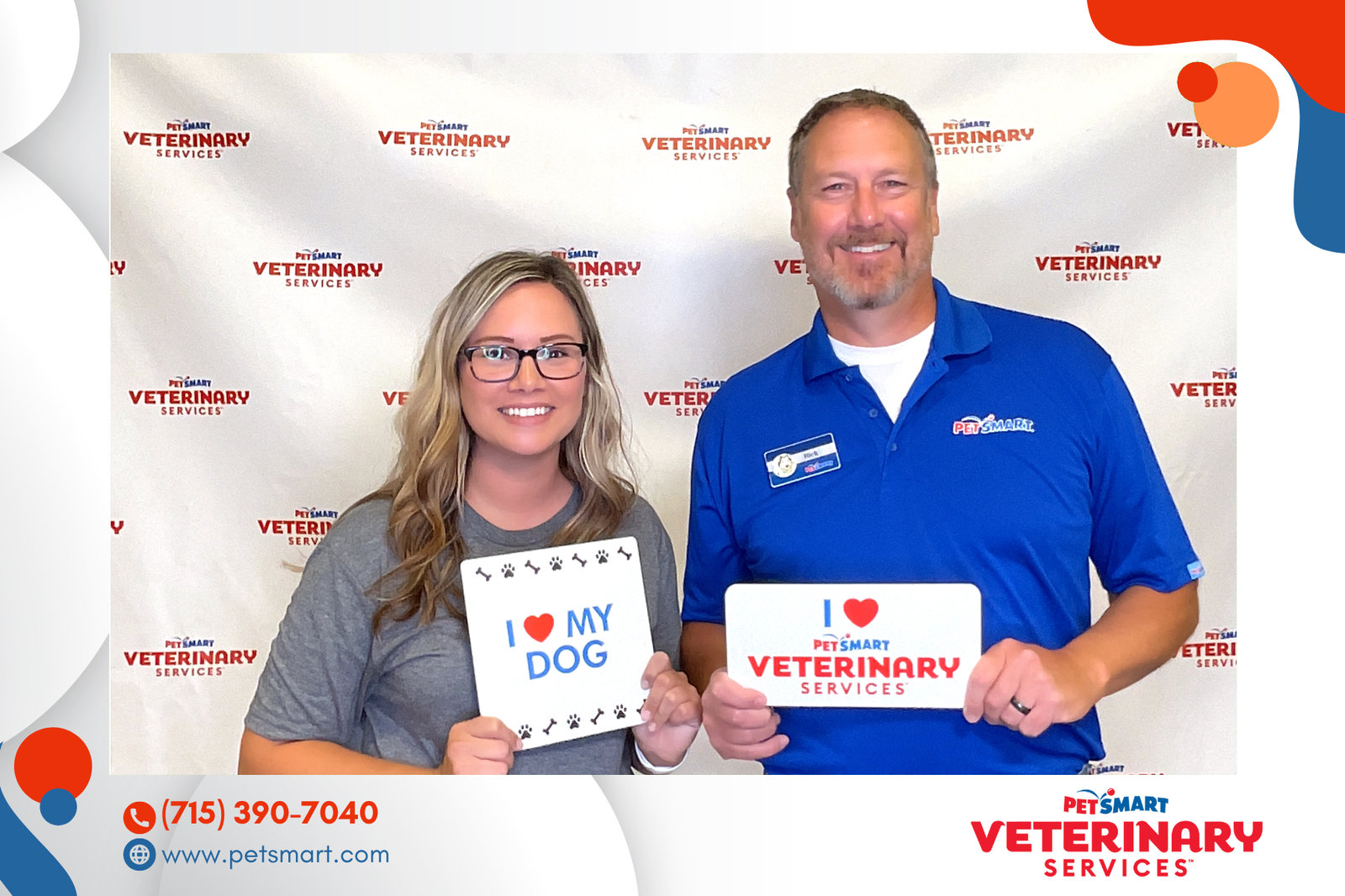 Veterinary clinic staff with branded signs at a corporate event